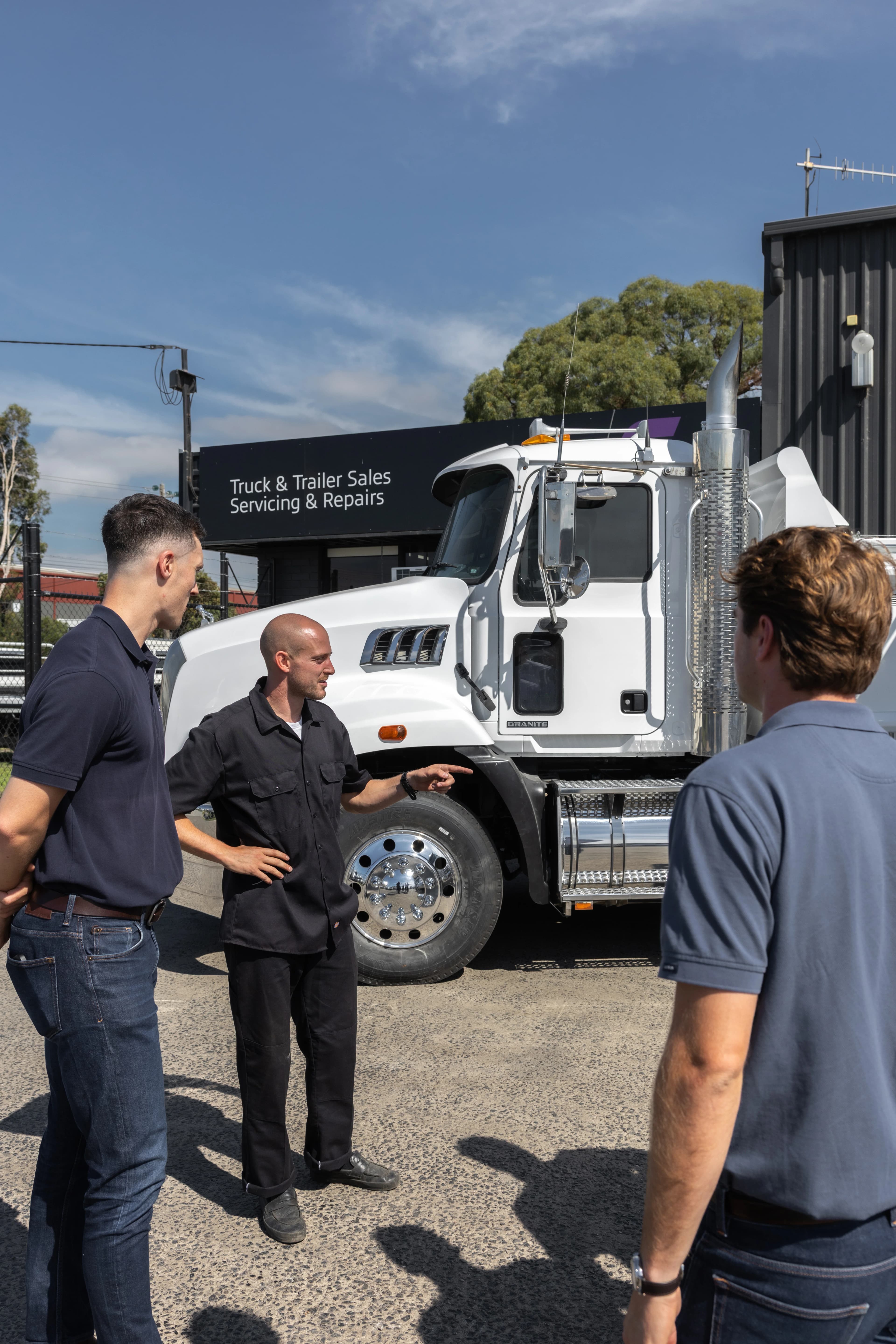 Three Peaks team with client discussing equipment