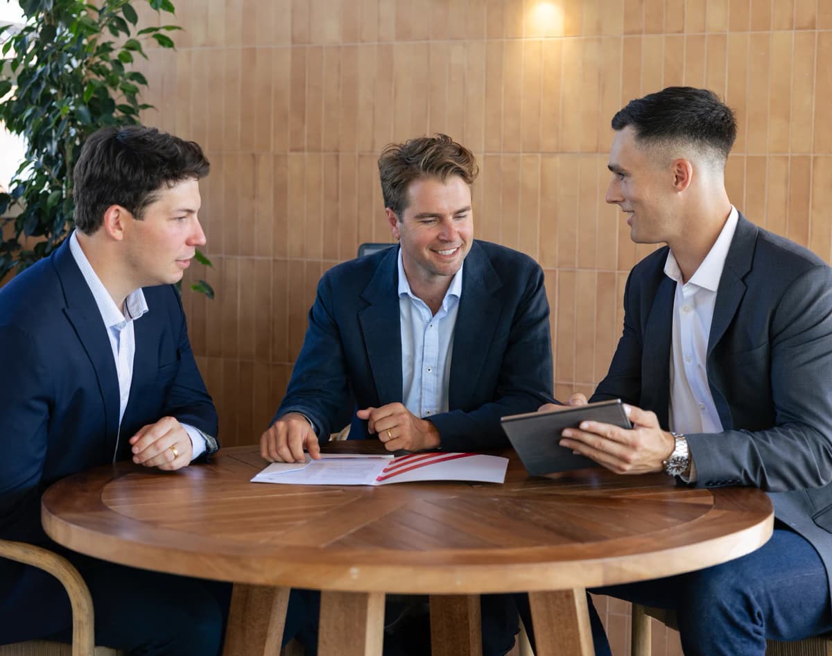 Three Peaks directors meeting with a client